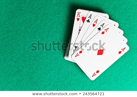 Foto d'archivio: Poker Concept With Cards On Green Table