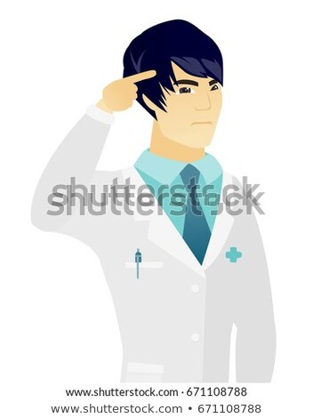 Stock photo: Doctor Gesturing With His Finger Against Temple