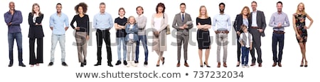 [[stock_photo]]: Young Man Standing With Arms Folded And Looking At Camera