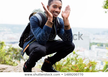 Stock photo: Smiling Boy Carrying His Backpack Crouching