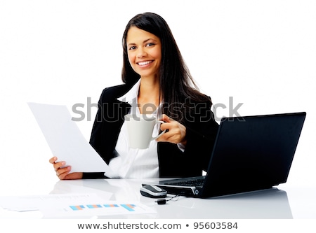 Foto stock: Attractive Businesswoman Reading Paperwork While Enjoying A Cup Of Coffee