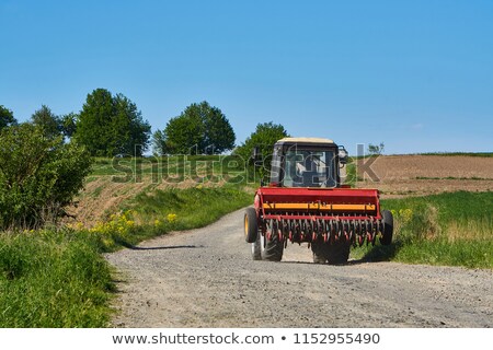 Foto stock: Farmer And Corn Crop Pile After Harvest