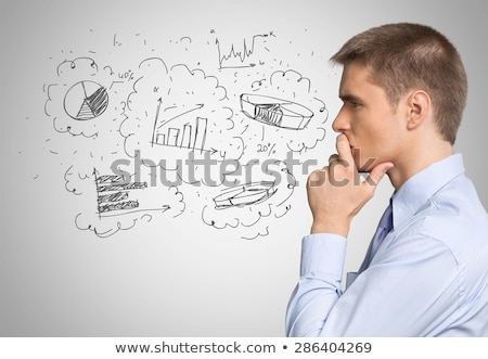 [[stock_photo]]: Thinking Businessman Standing With Hand On Chin