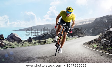 Stock photo: Biker Racing On The Road