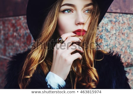 Stockfoto: Young Thoughtful Woman In Red Hat