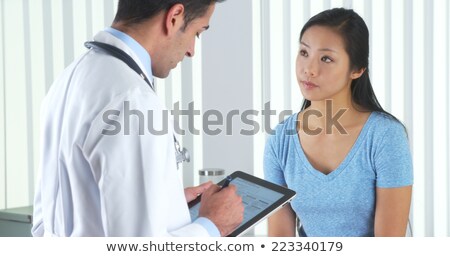 Foto stock: Doctor Asking Patient Questions