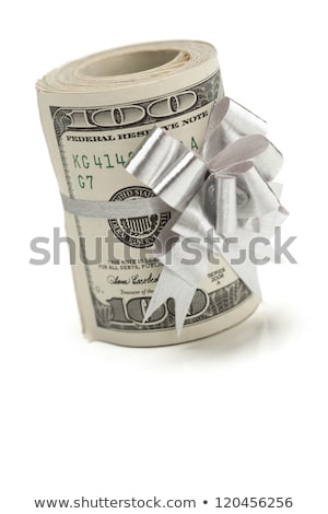 Stok fotoğraf: Roll Of One Hundred Dollar Bills With Silver Bow On White