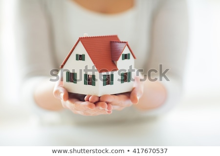 Stok fotoğraf: Close Up Of Hands Holding House Or Home Model