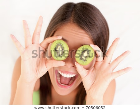 Woman Holding A Kiwi Stock fotó © Ariwasabi