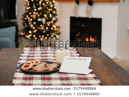 Сток-фото: Christmas Cookies And Milk On Plaid With Note For Santa