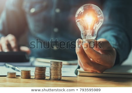 Stock fotó: Man Holding Lightbulb