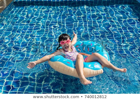 Stock photo: Happy Boy Is Swimming In The Outdoor Pool