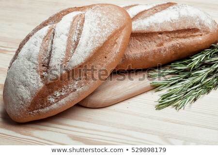 Foto d'archivio: Sliced Rye Bread And Two Loaves Of Wheat Flour