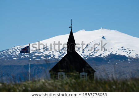 [[stock_photo]]: Snaefellsjokull And Icelandic Flag