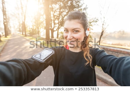 Stockfoto: Young Sporty Woman Taking Selfie Outdoor