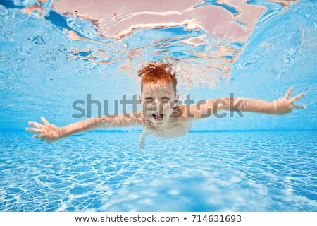 Stockfoto: Happy Young Boy Relaxing In A Summer Pool