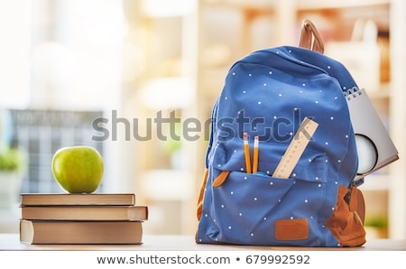 Foto stock: Apple Pile Of Books And Backpack