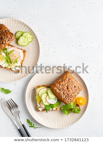 Foto stock: Homemade Bread With Fresh Creame Herbs And Radishes