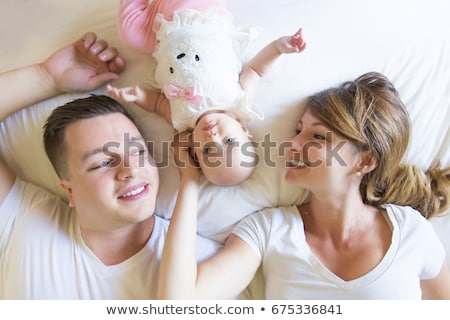 Stock fotó: Portrait Of Father With Her 3 Month Old Baby In Bedroom