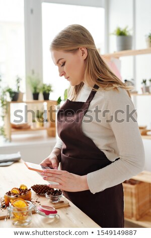 Stock fotó: Craftswoman With Smartphone Photographing Handmade Soap Bar And Other Stuff