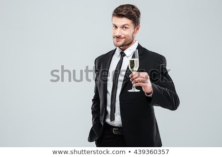 Foto stock: Businessman Holding A Glass Of Champagne