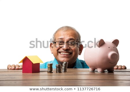 Foto stock: 3d White Man Holding A Piggy Bank
