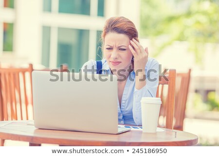 Foto d'archivio: Young Woman Sitting At The Computer Annoyed