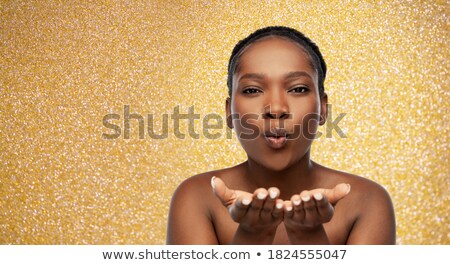 Stock foto: Beautiful Woman Sending Blow Kiss Over Glitter