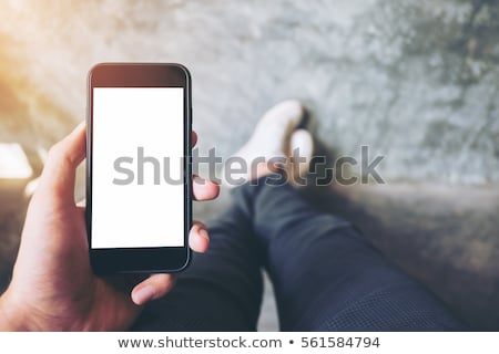 Сток-фото: Male Hand Holding Mobile Phone With Blank Mock Up Screen