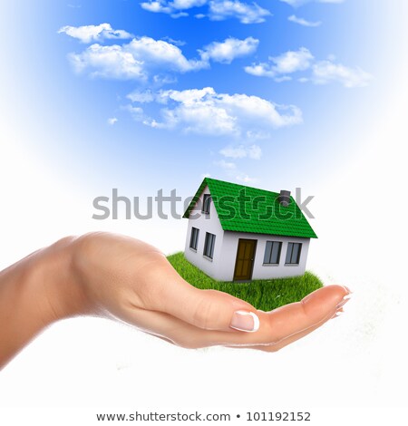 Stockfoto: Et · huis · in · de · handen · tegen · de · blauwe · lucht