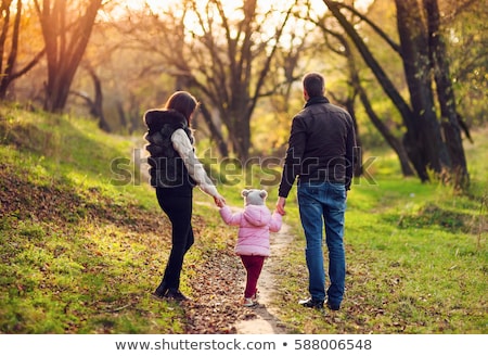 Foto stock: Three Kids Walking In The Woods
