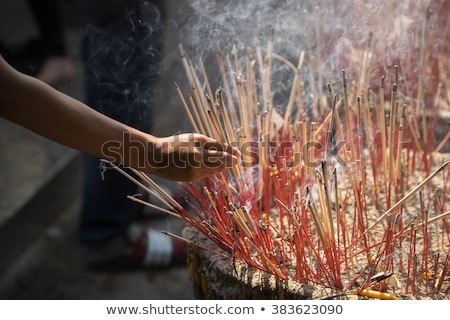 Stok fotoğraf: Incense Sticks On Joss Stick Pot Are Burning And Smoke Use For Pay Respect To The Buddha Respect To