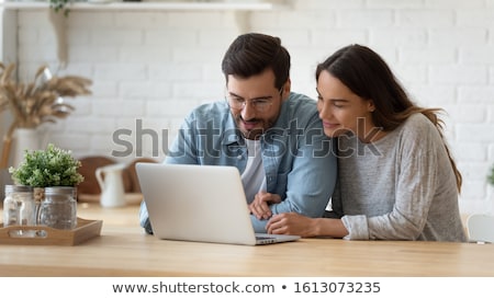 Zdjęcia stock: Smiling Couple Shopping Online On Laptop