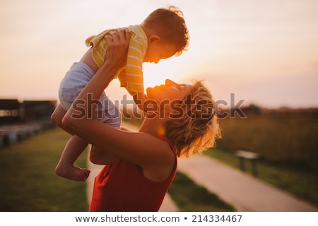 Stock photo: Mother And Child Together In A Meadow Playing And Having Fun