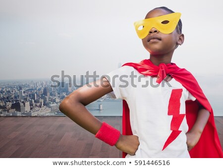 Zdjęcia stock: Girl In Superhero Costume Against Cityscape Background