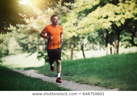 ストックフォト: Young Man Running In The Park