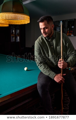 Stock fotó: Handsome Man With Suit Sitting In Billiard Pool