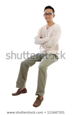 Asian Businessman Sitting On A Transparent Block Foto d'archivio © szefei