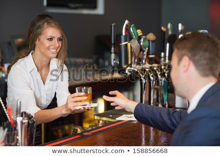 Foto stock: Young Waitress With Beer On White