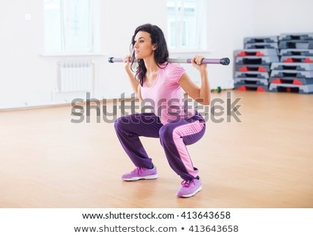 Stock fotó: Athletic Woman With Fitness Bar On Her Shoulders