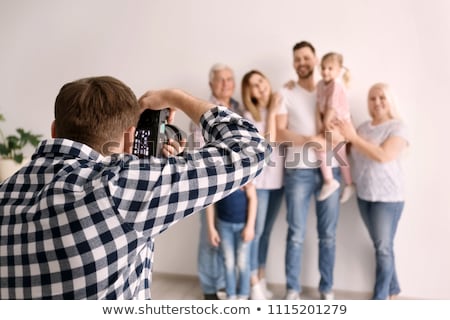 Stok fotoğraf: Family Taking Photo With Grandchild