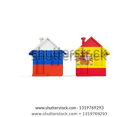 Stock fotó: Two Houses With Flags Of Russia And Spain