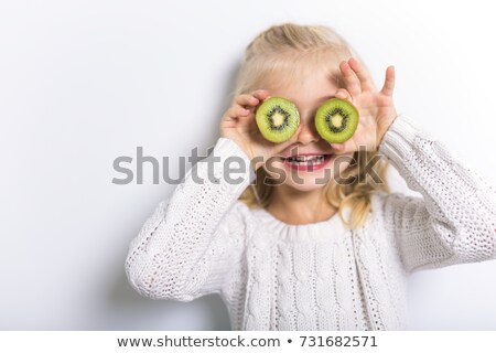 Stock photo: Cute Girl 4 5 Year Old Posing In Studio With Fruit Kiwi