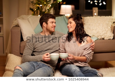 Stockfoto: Happy Couple Drinking Cacao At Home