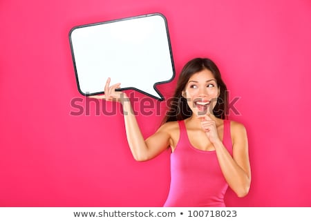 Excited Woman Holding A Blank Speech Bubble Stockfoto © Ariwasabi