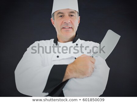 Stockfoto: Composite Image Of Chef With Knife Against Navy Background