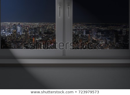 Foto stock: Businessman Looking To A Cityscape From A Dark Empty Room