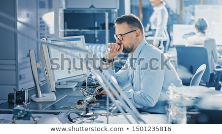 [[stock_photo]]: Female Computer Engineer Repairing Computer Motherboard