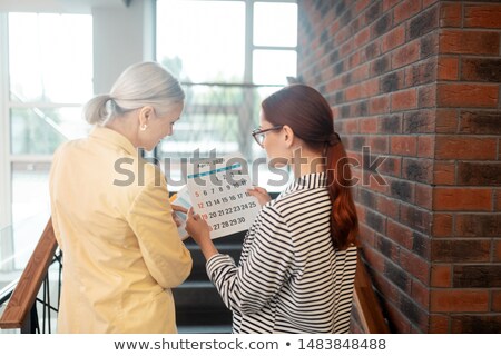 Zdjęcia stock: Senior Businesswoman Standing On The Stairs In Office