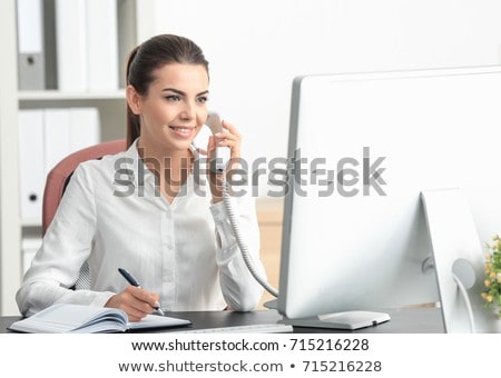 Сток-фото: Receptionist Woman Talking On Phone With Clients